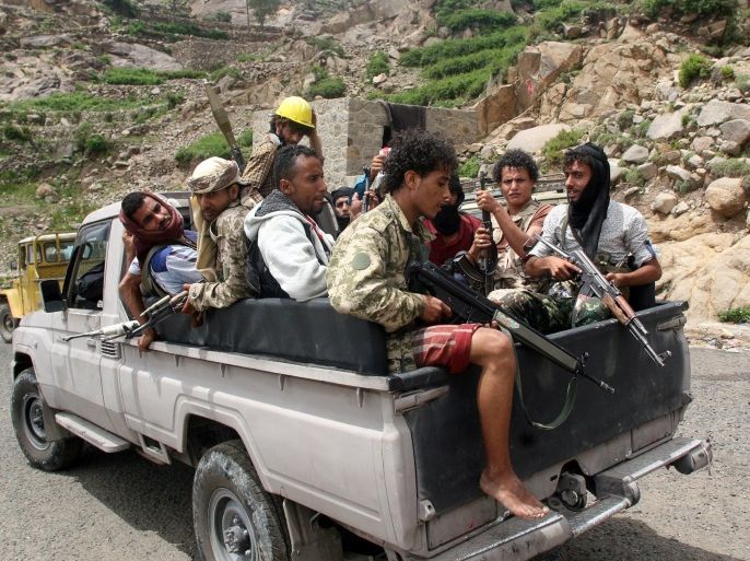 Pro-government fighters ride on the back of a patrol truck in a village taken by pro-government forces from the Iran-allied Houthi militia, in the al-Sarari area of Taiz province, Yemen July 28, 2016. REUTERS/Anees Mahyoub