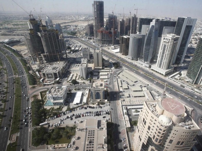 A general view of Doha city with buildings under construction in this December 24, 2012 file photo. The country of just 1.9 million people plans to spend about $140 billion to build stadiums, roads, railways, a new airport, a seaport and other infrastructure before it hosts the 2022 soccer World Cup. Spending on that scale could destabilise a much bigger economy. So recent data showing a sharp rise in inflation is unwelcome - and might, if it becomes a trend, threaten t