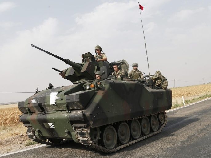 Turkish soldiers with tanks prepare for a military operation at the Syrian border as part of their offensive against the so-called Islamic State (IS or ISIS) militant group in Syria, in Karkamis district of Gaziantep, Turkey, 26 August 2016. The Turkish army launched an offensive operation against IS in Syria's Jarablus with its war jets and army troops in coordination with the US led coalition war planes.