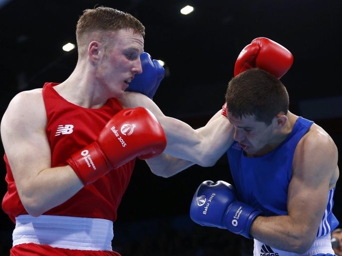 Michael O'Reilly of Ireland and Xaybula Musalov of Azerbaijan fight during their men's 75kg Middle weight boxing gold medal fight at the 1st European Games in Baku, Azerbaijan, June 27 , 2015. REUTERS/Kai Pfaffenbach