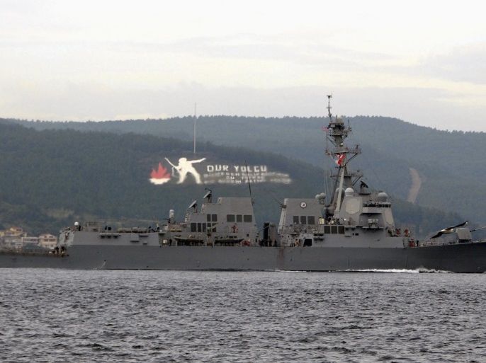 The U.S. Navy guided-missile destroyer USS Truxtun sets sail in the Dardanelles straits, on its way to the Black Sea March 7, 2014. The USS Truxtun is heading to the Black Sea for what the U.S. military on Thursday described as a "routine" deployment that was scheduled well before the crisis in Ukraine. REUTERS/Depo Photos (TURKEY - Tags: POLITICS MILITARY)