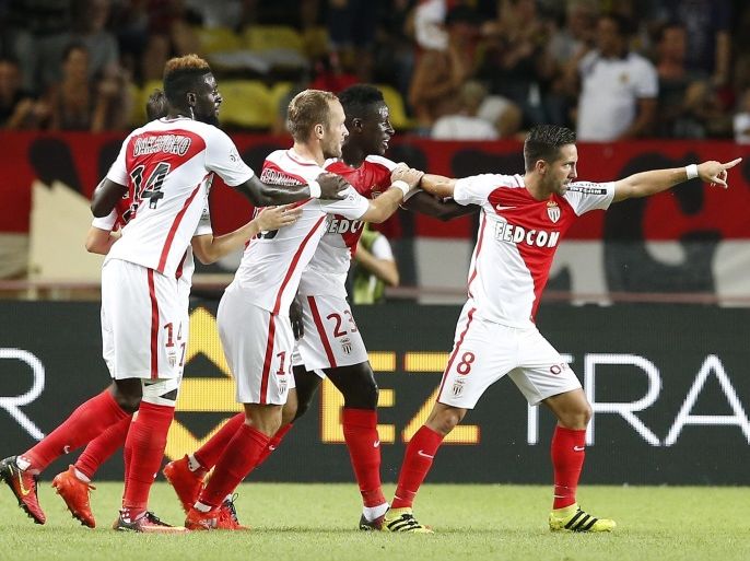 Joao Moutinho of AS Monaco (R) celebrates after scoring a goal against Paris Saint Germain during the French Ligue 1 soccer match between AS Monaco and Paris Saint Germain, at Stade Louis II, in Monaco, 28 August 2016.