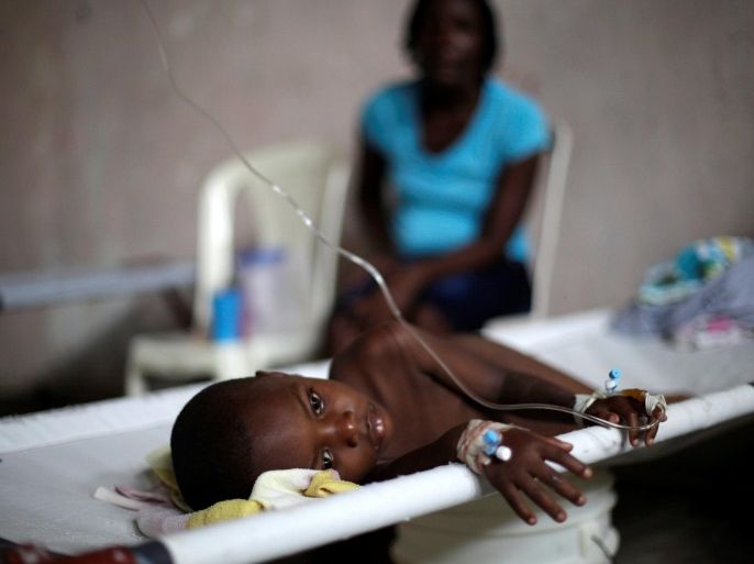 Evenel Dorvilier rests on a stretcher in the Cholera Treatment Center of Diquini in Port-au-Prince, Haiti, May 28, 2016. REUTERS/Andres Martinez Casares