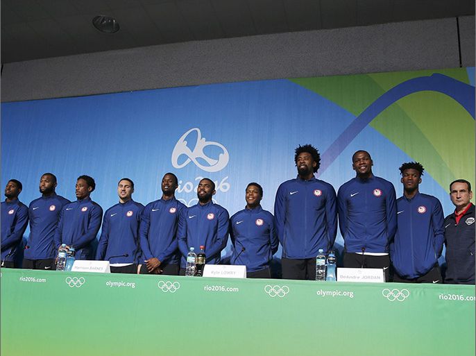 2016 Rio Olympics - Basketball - Main Press Centre - Rio de Janeiro, Brazil - 04/08/2016. The U.S. Men's basketball team poses for a photo with their head coach Mike Krzyzewski (USA) of the U.S. (2nd R) and managing director Jerry Colangelo (R) during a news conference. REUTERS/Lucy Nicholson