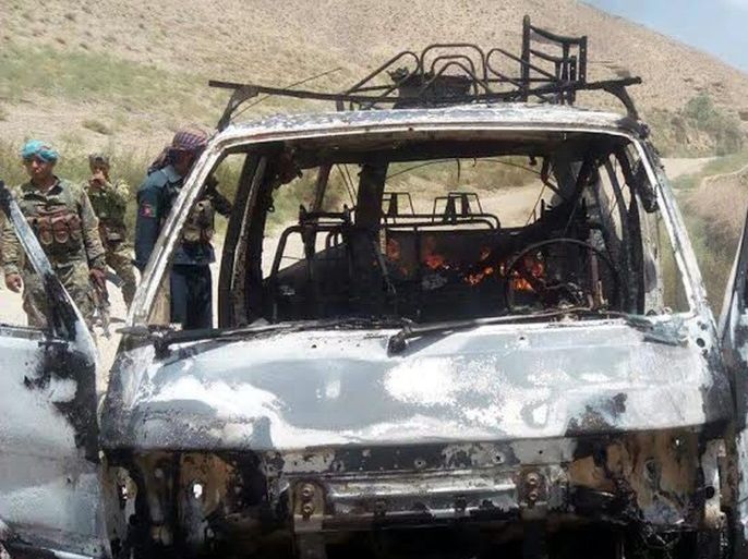 Afghan security officials inspect a van that was believed to have been transporting foreign tourists after it was hit by a Rocket propelled Grenade in Chesht-e-Sharif district of Herat province, Afghanistan, 04 August 2016. According to reports, a group of foreign tourists, including Britons, Americans and a German has been targeted in a rocket attack in Chisht-e-Sharif district of the Herat province on the same day, while there are no reports known yet of the number o
