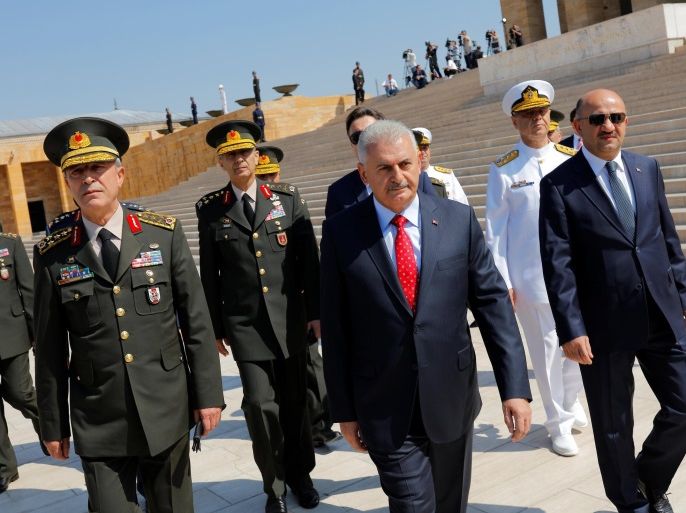 Turkey's Prime Minister Binali Yildirim (C), flanked by Chief of Staff General Hulusi Akar (L), Defense Minister Fikri Isik (R) and the country's top generals, leaves Anitkabir, the mausoleum of modern Turkey's founder Mustafa Kemal Ataturk, after a wreath-laying ceremony ahead of a High Military Council meeting in Ankara, Turkey, July 28, 2016. REUTERS/Umit Bektas