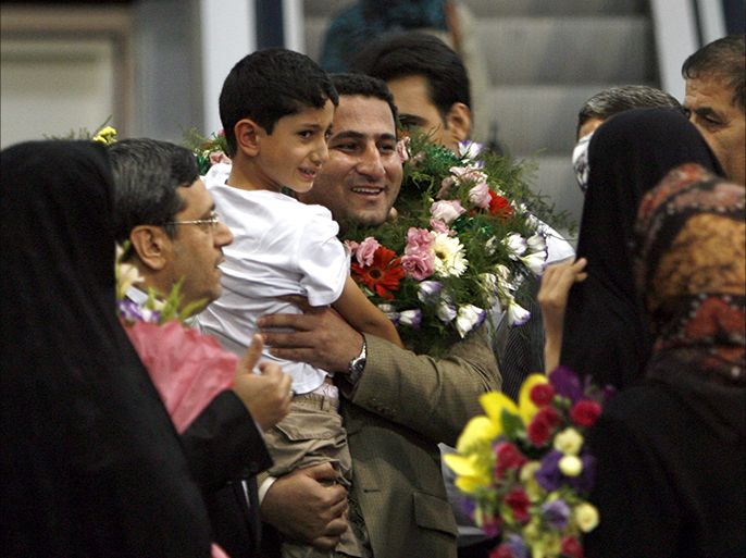 epa05460843 (FILE) A file picture dated 15 July 2010 shows Shahram Amiri (C), an Iranian nuclear scientist, welcomed by his family as he arrives at Tehran Imam Khomeini International Airport in Tehran, Iran. According to media reports on 07 August 2016 quoting Amiri's family members, the Iranian nuclear scientist, who was detained at a secret location since his return in 2010, has been executed on 03 August 2016. His body presented marks around his neck suggesting he was hanged, media added. Amiri, believed to have extensive knowledge of Iran's nuclear programme, upon his return in 2010 said he was abducted by the US Central Intelligence Agency (CIA) in June 2009 while on a pilgrimage to Mecca, Saudi Arabia, and forcefully transported from there to the US in an American military plane and allegedly tortured and forced to disclosing classified information on Iran's military nuclear programmes. EPA/ABEDIN TAHERKENAREH