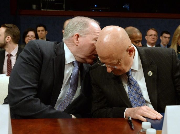 Central Intelligence Agency (CIA) Director John Brennan (L) speaks with Director of National Intelligence James Clapper (R) at the US House Intelligence Committee hearing on 'Worldwide Threats', on Capitol Hill in Washington, DC, USA, 04 February 2014.