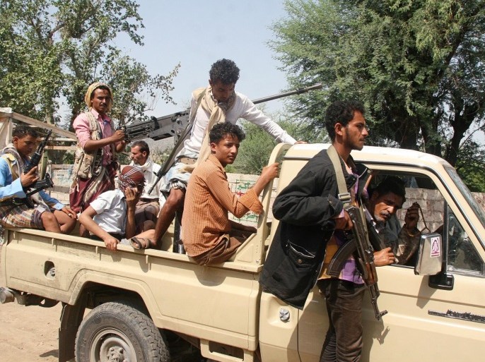 Pro-government fighters ride on the back of a truck at al-Dhabab area after they took it from Houthi fighters outside the southwestern city of Taiz, Yemen August 21, 2016. REUTERS/Anees Mahyoub