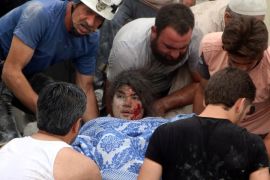 ATTENTION EDITORS - VISUAL COVERAGE OF SCENES OF INJURY OR DEATH Men carry an injured girl after an airstrike on Aleppo's rebel held Kadi Askar area, Syria July 8, 2016. REUTERS/Abdalrhman Ismail