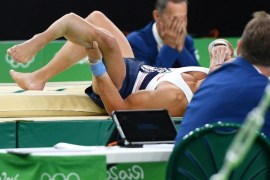 Samir Ait Said of France reacts after breaking his left leg as he landed a vault during the men's individual all-around qualification of the Rio 2016 Olympic Games Artistic Gymnastics events at the Rio Olympic Arena in Barra da Tijuca, Rio de Janeiro, Brazil, 06 August 2016.