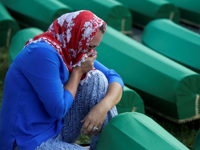 Muslim woman cry near coffins of their relatives, who are newly identified victims of the 1995 Srebrenica massacre, which are lined up for a joint burial in Potocari near Srebrenica, Bosnia and Herzegovina, July 10, 2016. REUTERS/Dado Ruvic