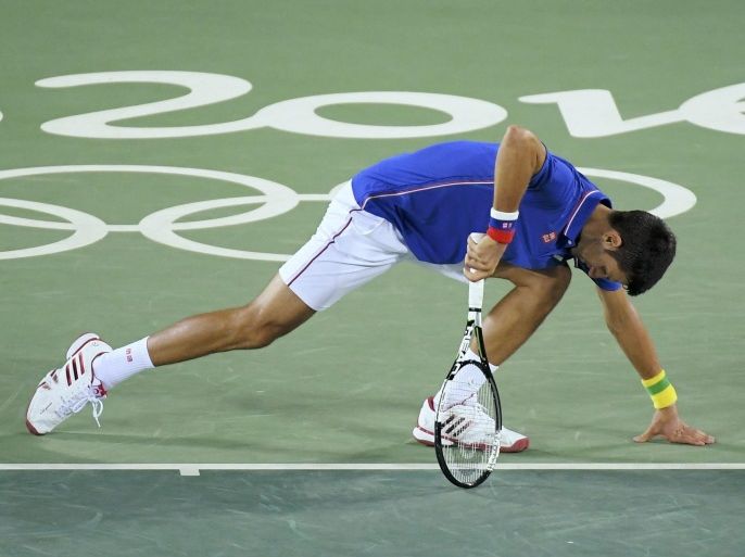 2016 Rio Olympics - Tennis - Preliminary - Men's Singles First Round - Olympic Tennis Centre - Rio de Janeiro, Brazil - 07/08/2016. Novak Djokovic (SRB) of Serbia in action against Juan Martin Del Potro (ARG) of Argentina. REUTERS/Toby Melville FOR EDITORIAL USE ONLY. NOT FOR SALE FOR MARKETING OR ADVERTISING CAMPAIGNS.