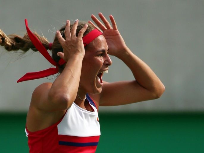 2016 Rio Olympics - Tennis - Semifinal - Women's Singles Semifinals - Olympic Tennis Centre - Rio de Janeiro, Brazil - 12/08/2016. Monica Puig (PUR) of Puerto Rico celebrates after winning her match against Petra Kvitova (CZE) of Czech Republic. REUTERS/Kevin Lamarque TPX IMAGES OF THE DAY. FOR EDITORIAL USE ONLY. NOT FOR SALE FOR MARKETING OR ADVERTISING CAMPAIGNS.