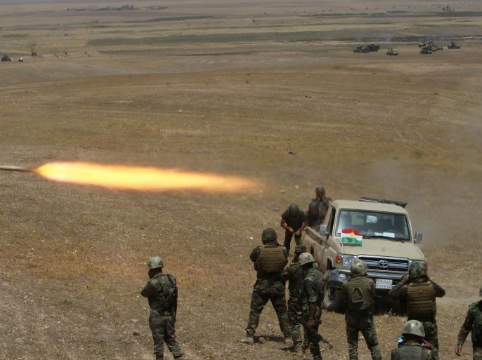 Kurdish Peshmerga forces fire a rocket toward Islamic State militants on the southeast of Mosul , Iraq, August 14, 2016. REUTERS/Azad Lashkari