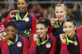 2016 Rio Olympics - Artistic Gymnastics - Final - Women's Team Victory Ceremony - Rio Olympic Arena - Rio de Janeiro, Brazil - 09/08/2016. Simone Biles (USA) of USA (L), Gabrielle Douglas (USA) of USA (Gabby Douglas) (top L), Laurie Hernandez (USA) of USA (C), Madison Kocian (USA) of USA (top R), Alexandra Raisman (USA) of USA (Aly Raisman) (R) pose with their gold medals on the podium after winning the women's team final. REUTERS/Mike Blake TPX IMAGES OF THE DAY. F