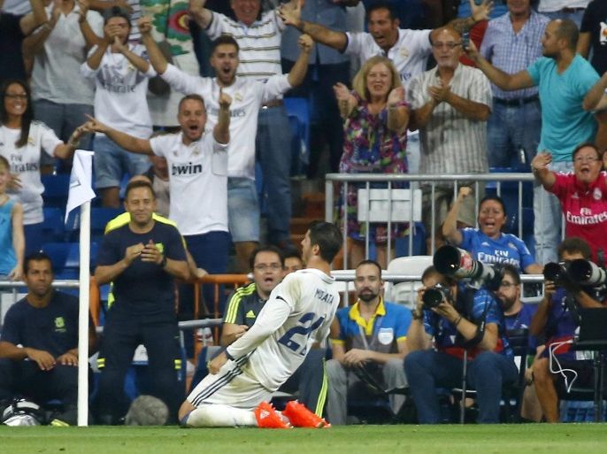Real Madrid's striker Alvaro Morata (L) celebrates his goal against Celta Vigo during their Primera Division soccer match played at Santiago Bernabeu stadium in Madrid, Spain on 27 August 2016.