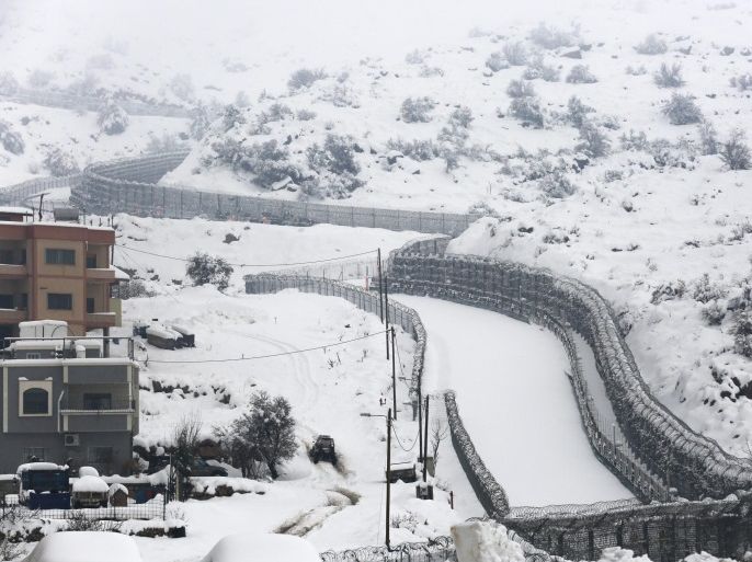 A view of the Israeli-Syrian border fence next to the Druze village of Majdal Shams, North of the Golan Heights, Israel, 12 February 2015, during a winter snowstorm.