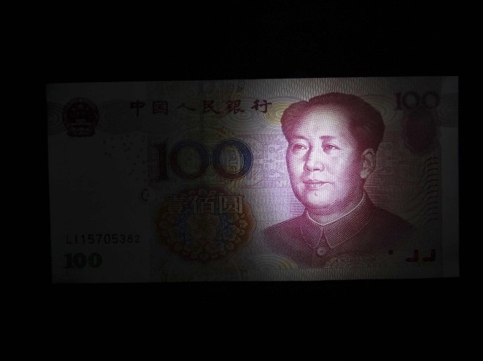 A Chinese 100 yuan banknote is seen in this file picture illustration taken in Shanghai on January 19, 2011. As China intensifies its efforts to discipline risky lenders and calm exuberant credit growth, financial stress is building in the country and underground debt is becoming one of the biggest banking risks. REUTERS/Aly Song/Files (CHINA - Tags: BUSINESS POLITICS)