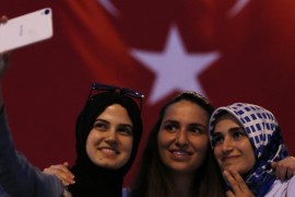 Women take selfies under a Turkish flag during the celebration rally at Taksim Square, in Istanbul, Turkey, 18 July 2016. Turkish Prime Minister Yildirim reportedly said that the Turkish military was involved in an attempted coup d'etat. Turkish President Recep Tayyip Erdogan has denounced the coup attempt as an 'act of treason' and insisted his government remains in charge. Some 104 coup plotters were killed, 90 people - 41 of them police and 47 are civilians - 'fell martrys', after an attempt to bring down the Turkish government, the acting army chief General Umit Dundar said in a televised appearance.who were killed in a coup attempt on 16 July, during the funeral, in Istanbul, Turkey, 17 July 2016. Turkish Prime Minister Yildirim reportedly said that the Turkish military was involved in an attempted coup d'etat. Turkish President Recep Tayyip Erdogan has denounced the coup attempt as an 'act of treason' and insisted his government remains in charge. Some 104 coup plotters were killed, 90 people - 41 of them police and 47 are civilians - 'fell martrys', after an attempt to bring down the Turkish government, the acting army chief General Umit Dundar said in a televised appearance.