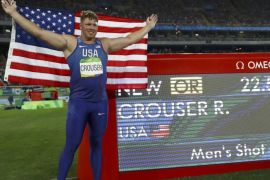 2016 Rio Olympics - Athletics - Final - Men's Shot Put Final - Olympic Stadium - Rio de Janeiro, Brazil - 18/08/2016. Ryan Crouser (USA) of USA celebrates winning the gold medal and setting a new Olympic record. REUTERS/Kai Pfaffenbach FOR EDITORIAL USE ONLY. NOT FOR SALE FOR MARKETING OR ADVERTISING CAMPAIGNS.