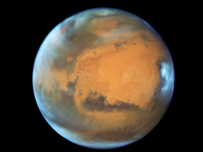 The planet Mars is shown May 12, 2016 in this NASA Hubble Space Telescope view taken May 12, 2016 when it was 50 million miles from Earth. Earth's neighbor planet makes its closest approach in a decade this month, providing sky-watchers with a celestial show from dusk to dawn. NASA/Handout via Reuters ATTENTION EDITORS - THIS IMAGE WAS PROVIDED BY A THIRD PARTY. EDITORIAL USE ONLY