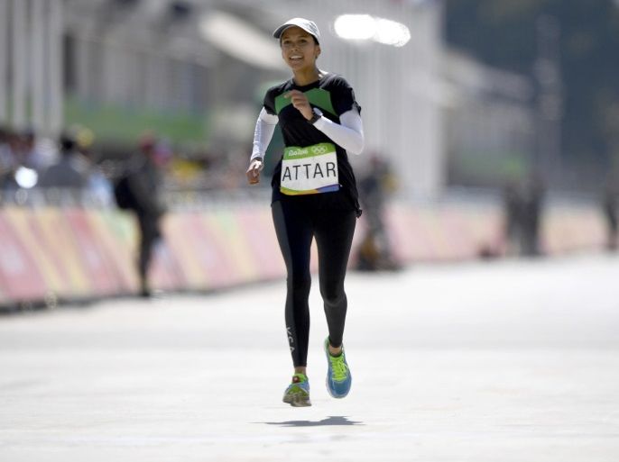 2016 Rio Olympics - Athletics - Final - Women's Marathon -Sambodromo - Rio de Janeiro, Brazil - 14/08/2016. Sarah Attar (KSA) of Saudi Arabia finishes second to last REUTERS/Dylan Martinez FOR EDITORIAL USE ONLY. NOT FOR SALE FOR MARKETING OR ADVERTISING CAMPAIGNS.
