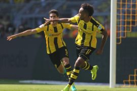 Dortmund's Pierre-Emerick Aubameyang and Marc Bartra (l) celebrating the 1:0 goal against Mainz in the match of Borussia Dortmund against FSV Mainz 05 on the first match day of the Bundesliga at Signal Iduna Park in Dortmund, Germany, 27 August 2016. (EMBARGO CONDITIONS - ATTENTION: Due to the accreditation guidelines, the DFL only permits the publication and utilisation of up to 15 pictures per match on the internet and in online media during the match.)