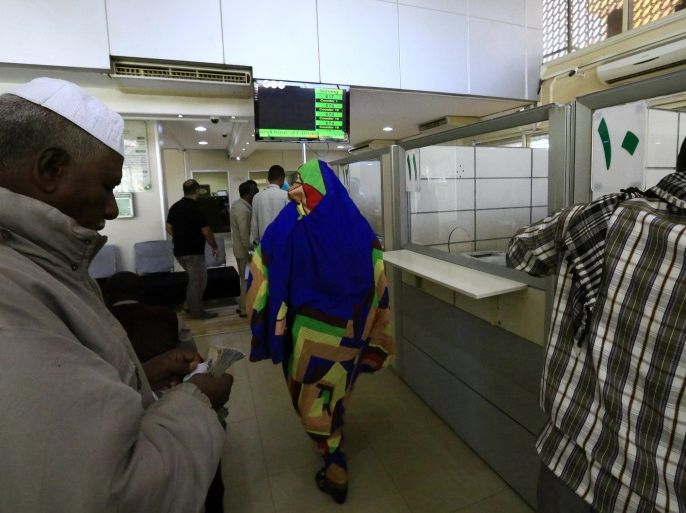 A man counts money inside the Faisal Islamic Bank in Khartoum, Sudan January 12, 2016. Picture taken January 12, 2016. REUTERS/Mohamed Nureldin Abdallah