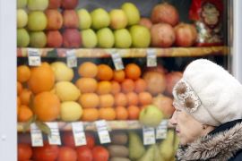 A Russian woman peers through the window to view fruits and vegetables at a street side market in Moscow, Russia, 02 December 2015. Russian government banned import fruits and vegetables from Turkey as Russian Sukhoi SU-24 bomber jet downed 24 November by a Turkish F-16 fighter on the border with Syria. The list of products, ratified by the Russian Prime Minister Dmitri Medvedev, and will come into force on 01 January 2016.