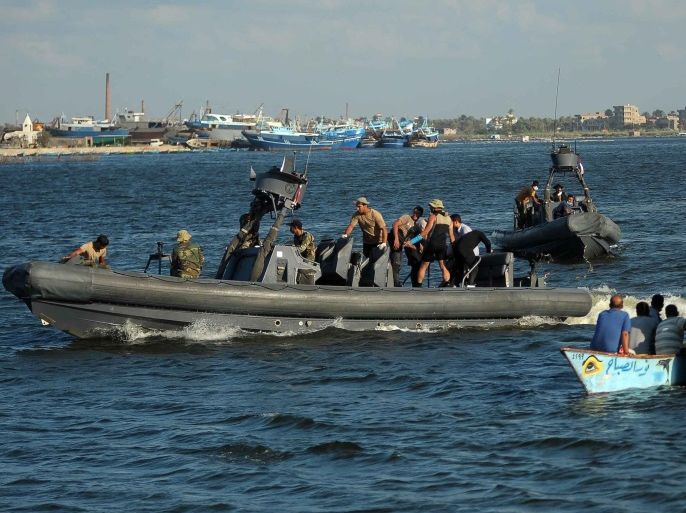 Military Rigid-hilled inflatable boats (RHIB) carrying recovered bodies placed in body bags arrive to the shore, the port city of Rosetta, some 250km north of Cairo, Egypt, 22 September 2016. According to media reports, 163 bodies were recovered after a boat carrying migrants capsized. The number of passengers on board is not yet confirmed with media reporting between 300 and 600. EPA/TAREK ALFARAMAWY EGYPT OUT
