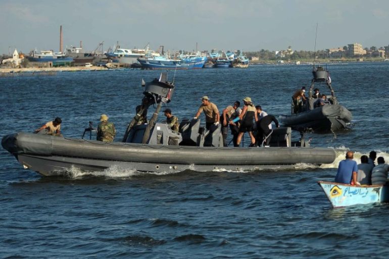 Military Rigid-hilled inflatable boats (RHIB) carrying recovered bodies placed in body bags arrive to the shore, the port city of Rosetta, some 250km north of Cairo, Egypt, 22 September 2016. According to media reports, 163 bodies were recovered after a boat carrying migrants capsized. The number of passengers on board is not yet confirmed with media reporting between 300 and 600. EPA/TAREK ALFARAMAWY EGYPT OUT