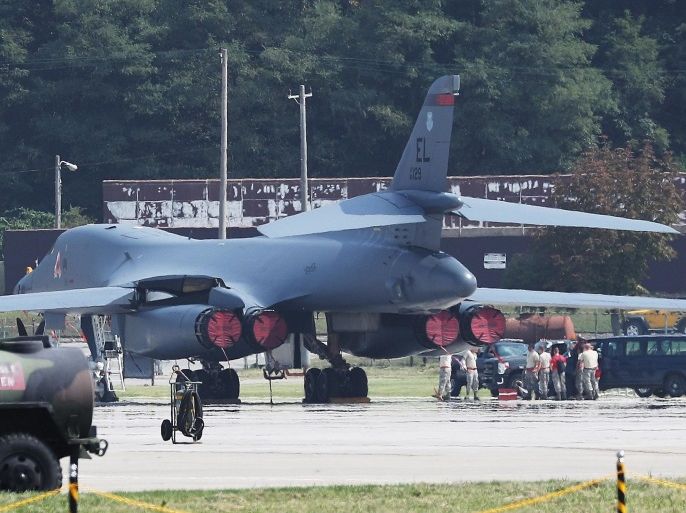 A US soldier walks near a B-1B Lancer bomber deployed by the U.S. military at Osan Air Base, south of Seoul, South Korea, 23 September 2016, as the US Air Force holds a preview of the 2016 Air Power Day that will run from 24 - 25 September 2016. The bomber is one of the two B-1B Lancer bombers that the United States deployed two days ago from Guam to show its strong commitment to its key Asian ally amid evolving threats from North Korea. It marked the first time for a B
