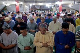 A picture made available on 05 July 2016 shows rows of Muslims performing their evening terawih prayers under a sheltered common area in the Choa Chu Kang district of Singapore, 29 June 2016. During the Islamic holy month of Ramadan, Muslims are encouraged to perform 'terawih' or evening congregational prayers after they break their fast at dusk. Spaces such as this sheltered common area, or the void deck below residential apartments, are cordoned off and reserved for a month so that Muslims have a space nearby their homes to gather in the evening to perform their terawih prayers. The operational and logistic needs of running these spaces are typically met by volunteers who reside nearby, with mosques only helping out with any financial or administrative difficulties the volunteers might face. In some cases, an imam or ustaz, religious leaders or scholars, might be provided from a district mosque if the community is unable to find an individual who can take up the role of leading the prayer sessions. These community-run spaces relieve the demands on mosques to cater for the Muslim populace during Ramadan and are a more convenient option for older Muslims and foster bonding amongst the community through their faith.