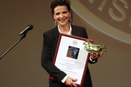 French actress Juliette Binoche poses with the Ambassador of the European Cinema Award she took over during the opening ceremony of the 13th Jameson CineFest Miskolc International Film Festival in Miskolc, 174 kms northeast of Budapest, Hungary, 09 September 2016. Special guest Juliette Binoche will be awarded with the CineFest Europe Prize during the opening day. The international cinematic contest, which screens 18 long feature films besides short features, animation and experimental films, runs from 09 to 18 September. EPA/JANOS VAJDA HUNGARY OUT