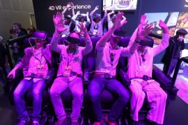 Attendees react as they use Samsung Galaxy smartphones to take a virtual reality (VR) simulated ride at Six Flags during the E3 (Electronic Entertainment Expo) in Los Angeles, California, USA, 14 June 2016. The E3 expo introduces new games and gaming devices and is an anticipated annual event among gaming enthusiasts and marketers. The event runs from 14 to 16 June 2016.