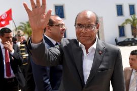 Former Tunisian president Moncef Marzouki arrives to take part in an anti-extremism march in Tunis March 29, 2015. World leaders joined tens of thousands of Tunisians on Sunday to march in solidarity against Islamist militants, a day after security forces killed members of a group blamed for a deadly museum attack. REUTERS/Emmanuel Dunand/Pool
