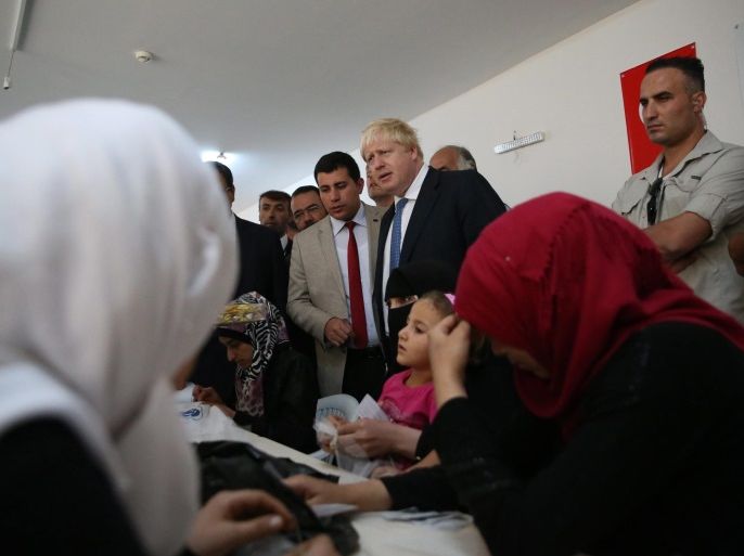 British Foreign Secretary Boris Johnson (C) meets refugees during a visit to a refugee camp in the Nizip province of Gaziantep, Turkey, 26 September 2016. Johnson is on a three-day visit to Turkey and is expected to travel to Ankara for talks with Turkish officials, including Turkish President Recep Tayyip Erdogan.