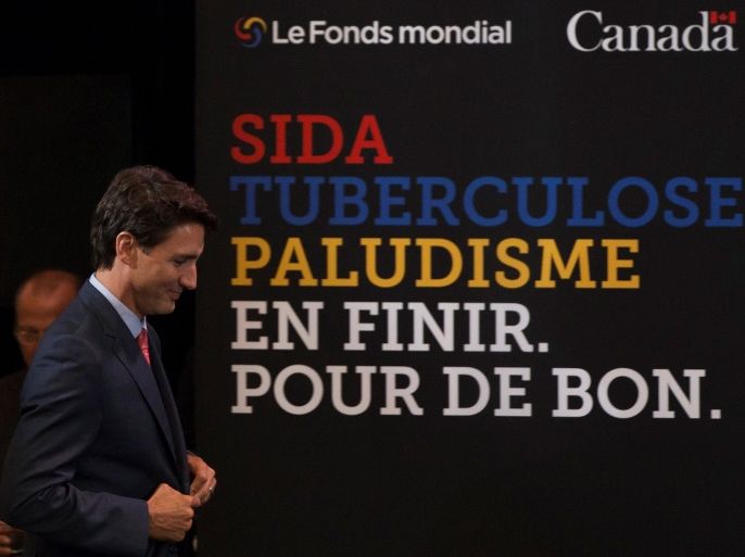 Canada's Prime Minister Justin Trudeau walks to the podium to give opening remarks at the Fifth Replenishment Conference of the Global Fund to Fight AIDS, Tuberculosis, and Malaria in Montreal, Quebec September 16, 2016. REUTERS/Christinne Muschi