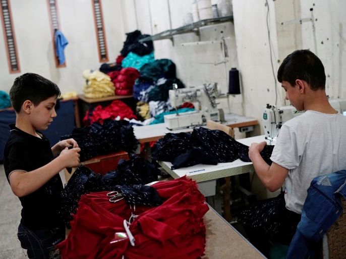 Syrian refugee boys work at a small textile factory in Gaziantep, where they are employed by a 30-year-old Turk who gave his name as Selim, in Turkey, May 16, 2016. Picture taken May 16, 2016. To match Special Report EUROPE-MIGRANTS/TURKEY-CHILDREN REUTERS/Umit Bektas