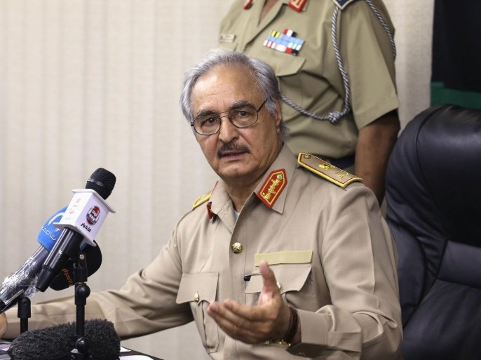 Then-General Khalifa Haftar speaks during a news conference in Abyar, east of Benghazi May 31, 2014. Growing frustration over the reality of life in eastern Libya, which contrasts with the promises of politicians, is feeding support for Haftar, who has set himself up as a warrior against Islamist militancy and who some also see as their saviour. Picture taken May 31, 2014. REUTERS/Esam Omran Al-Fetori (LIBYA - Tags: CIVIL UNREST POLITICS MILITARY)