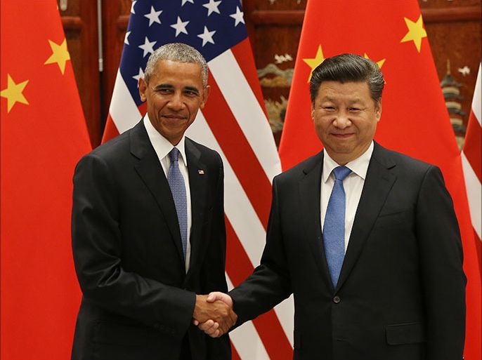 epa05521875 US President Barack Obama (L) and Chinese President Xi Jinping shake hands during their meeting at the West Lake State Guest House in Hangzhou, China, 03 September 2016. The G20 Summit will be held in Hangzhou on 04 to 05 September. EPA/HOW HWEE YOUNG