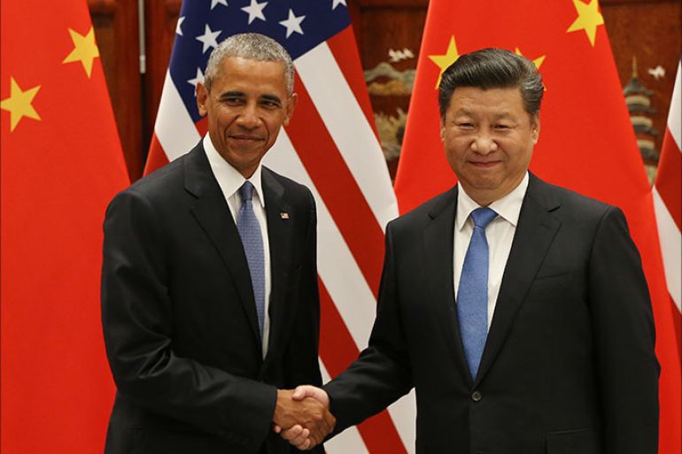 epa05521875 US President Barack Obama (L) and Chinese President Xi Jinping shake hands during their meeting at the West Lake State Guest House in Hangzhou, China, 03 September 2016. The G20 Summit will be held in Hangzhou on 04 to 05 September. EPA/HOW HWEE YOUNG