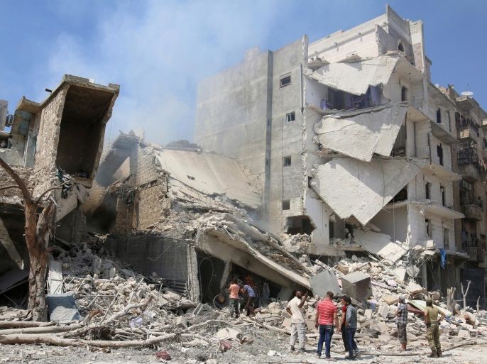 Men inspect a damaged site after double airstrikes on the rebel held Bab al-Nairab neighborhood of Aleppo, Syria, August 27, 2016. REUTERS/Abdalrhman Ismail/File Photo
