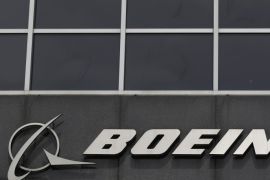 The Boeing logo is seen at their headquarters in Chicago, in this file photo taken April 24, 2013. Boeing Co said on Wednesday it had won orders and commitments from China for 250 narrowbody 737 aircraft and 50 widebody aircraft, valued at about $38 billion at list prices. REUTERS/Jim Young/Files