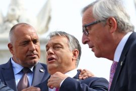 Bulgarian Prime Minister Boyko Borisov (L) and Hungarian Prime Minister Viktor Orban (C) joke around while European Commission President Jean-Claude Juncker (R) walks byafter a group photo being taken at the Bratislava Castle during the Bratislava EU summit, an informal meeting of the 27 heads of state or government, in Bratislava, Slovakia, 16 September 2016. European Union leaders meet to discuss a new strategy and future of the European Union after the recent Brexit