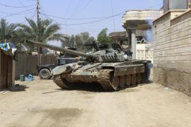 A tank of the Iraqi security forces is seen in the town of Hit in Anbar province, Iraq April 12, 2016. Picture taken April 12 2016. REUTERS/Stringer