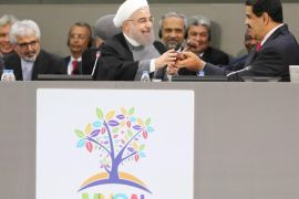A handout photo provided by the Mirafloress press office on 17 September 2016 ashows Head of State of Iran, Hassan Rouhani (L), handing over the Non-Aligned Movement's (NAM) Presidency to his Venezuelan couterpart Nicolas Maduro (R), during the NAM's Summit in Margarita, Venezuela, 17 September 2016. The organization formed as an attempt to thwart the Cold War, was founded in Belgrade in 1961, and consists of a group of states which are not formally aligned with or ag