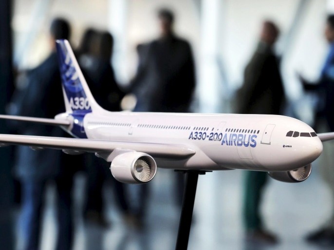 People speak together near a scale model of an Airbus A330-200 during the Airbus annual news conference in Colomiers, near Toulouse, France, in this January 13, 2015 file photo. Airbus Group is expected to hold its AGM this week. REUTERS/Regis Duvignau/FilesGLOBAL BUSINESS WEEK AHEAD PACKAGE - SEARCH "BUSINESS WEEK AHEAD MAY 25" FOR ALL IMAGES