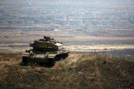 The Syrian area of Quneitra is seen in the background as an out-of-commission Israeli tank parks on a hill, near the ceasefire line between Israel and Syria, in the Israeli-occupied Golan Heights, August 21, 2015. REUTERS/Baz Ratner/File Photo